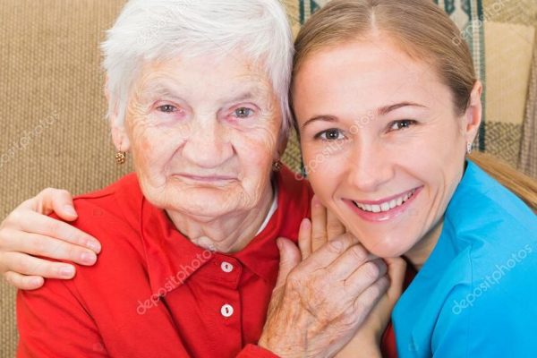 Elderly woman and young carer